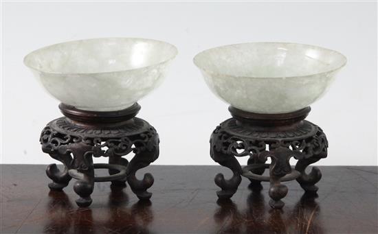 A pair of Chinese ice white and pale green jadeite bowls, early 20th century, diameter 7cm